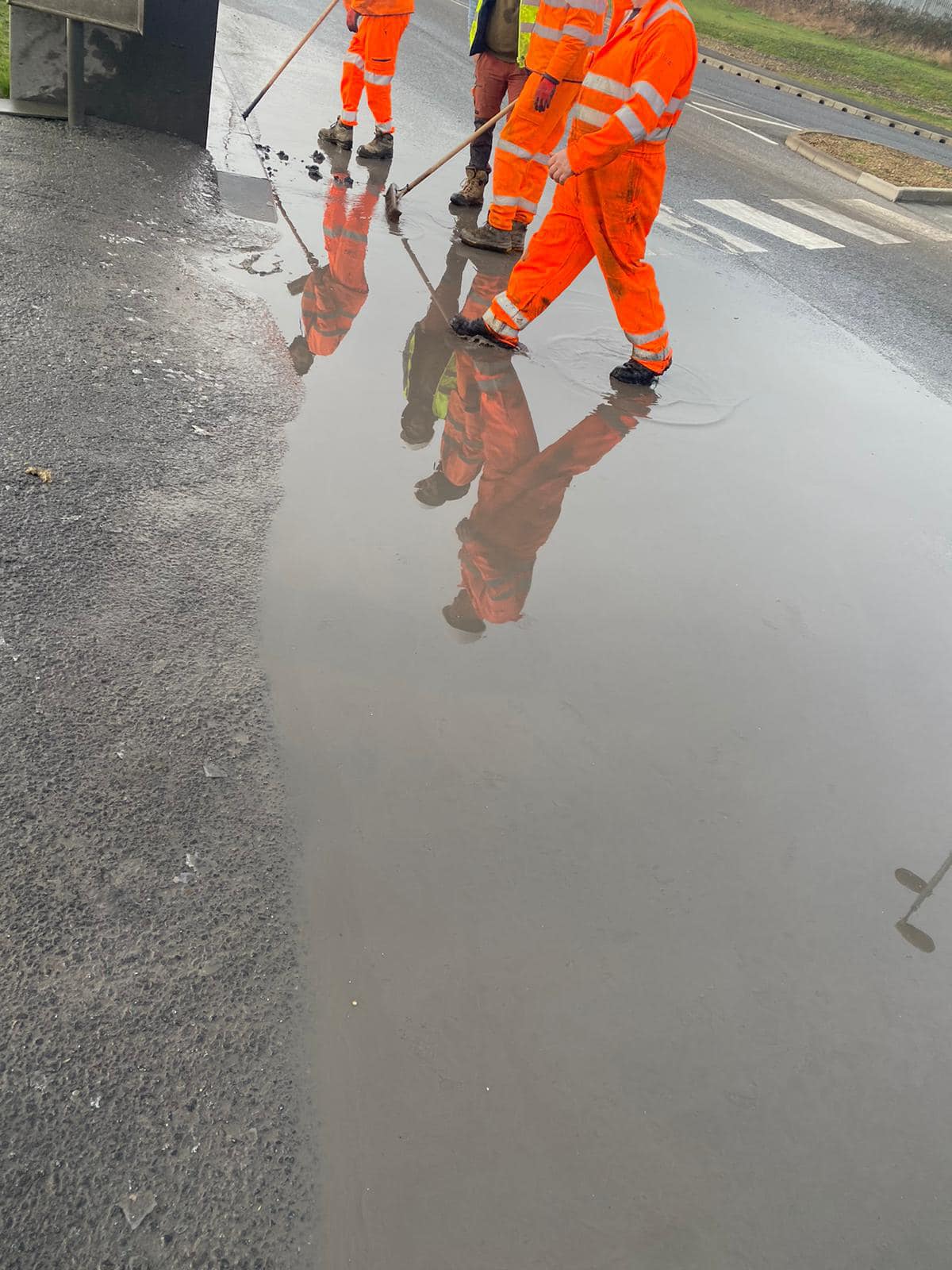 Drain Technology workers assessing flooded area in preparation for flood prevention worrks.