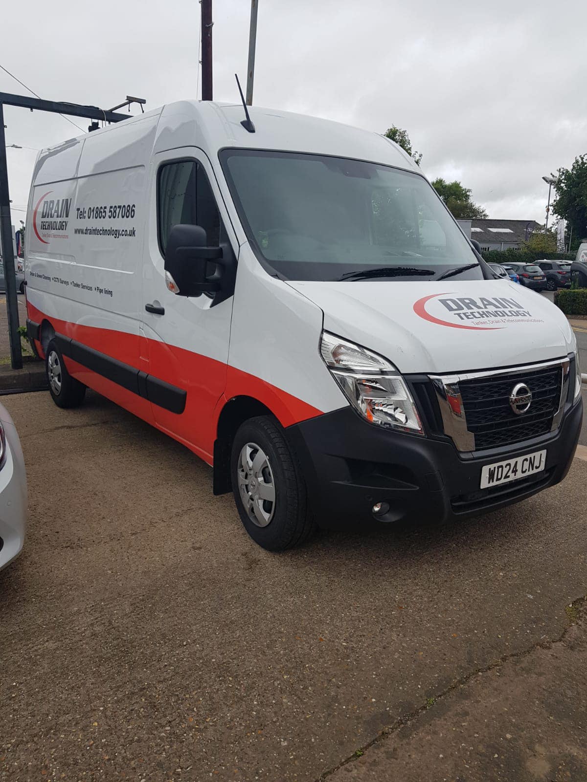 Nissan van with Drain Technology branding on the site and bonnet