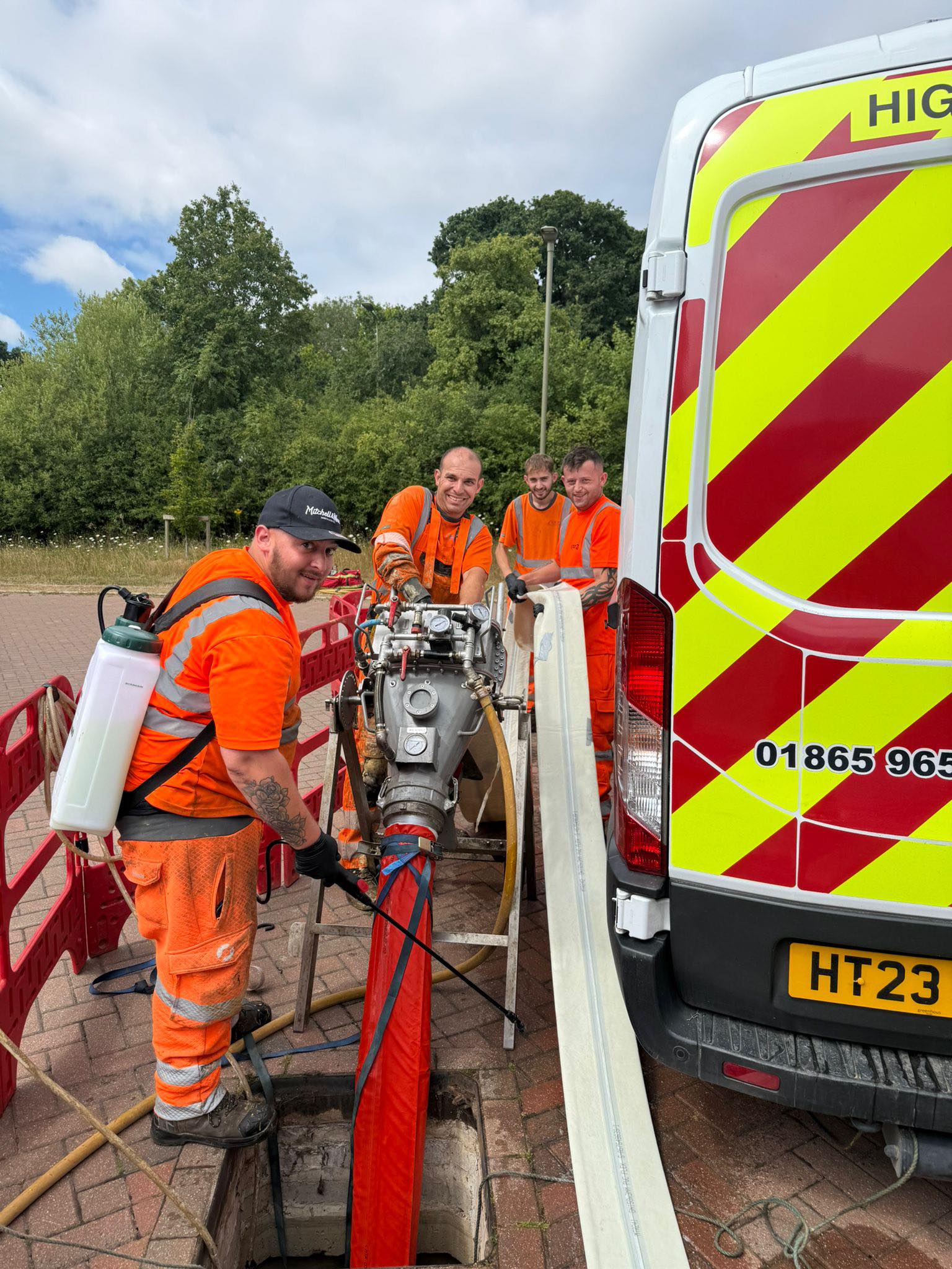 Four men working on drain