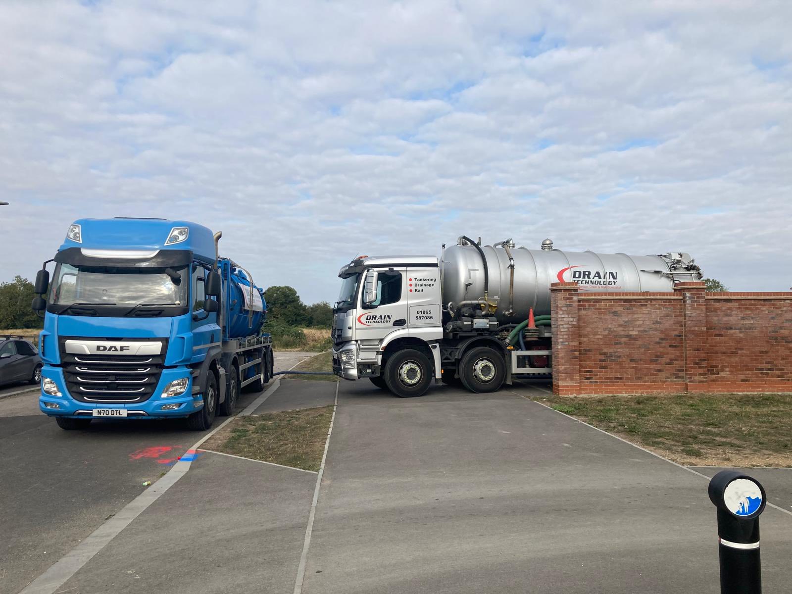 Two drainage tankers on roadside