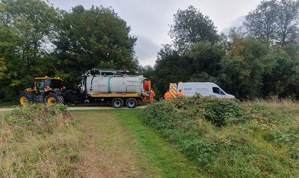 Tractor and tanker in field