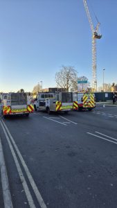 Back view of three TTM vans completing a road block