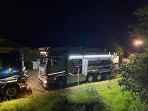 Tanker by the road side at night