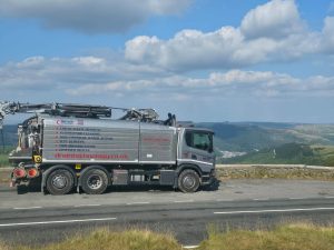 grey lorry in the hills 