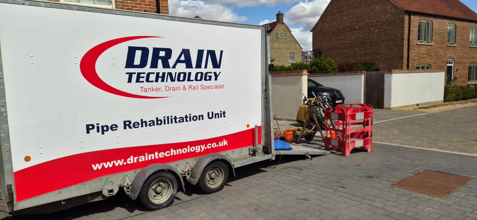 Drain Technology Pipe Rehabilitation Unit in use in a residential area
