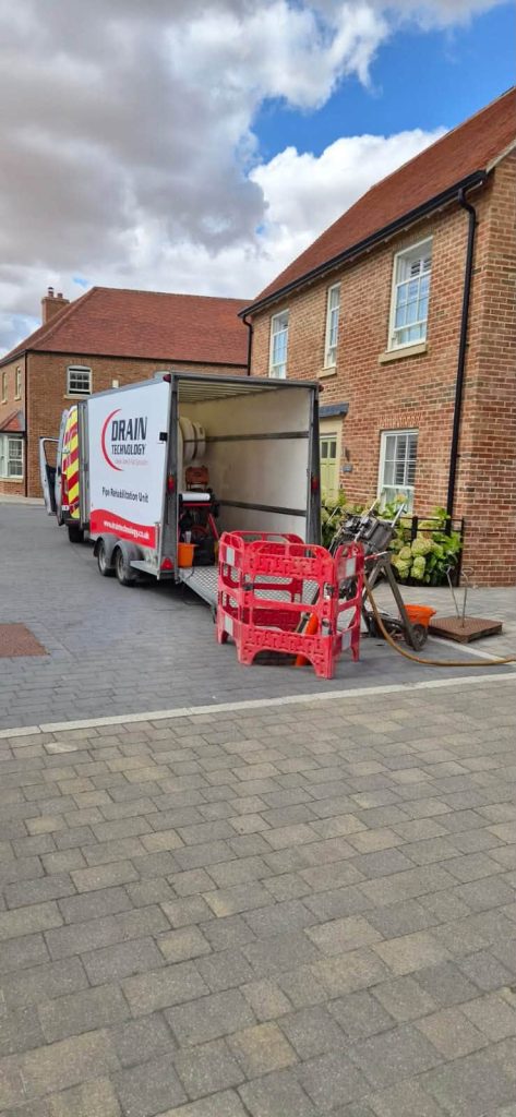 Drain Technology Pipe Rehabilitation Unit in use in a residential area