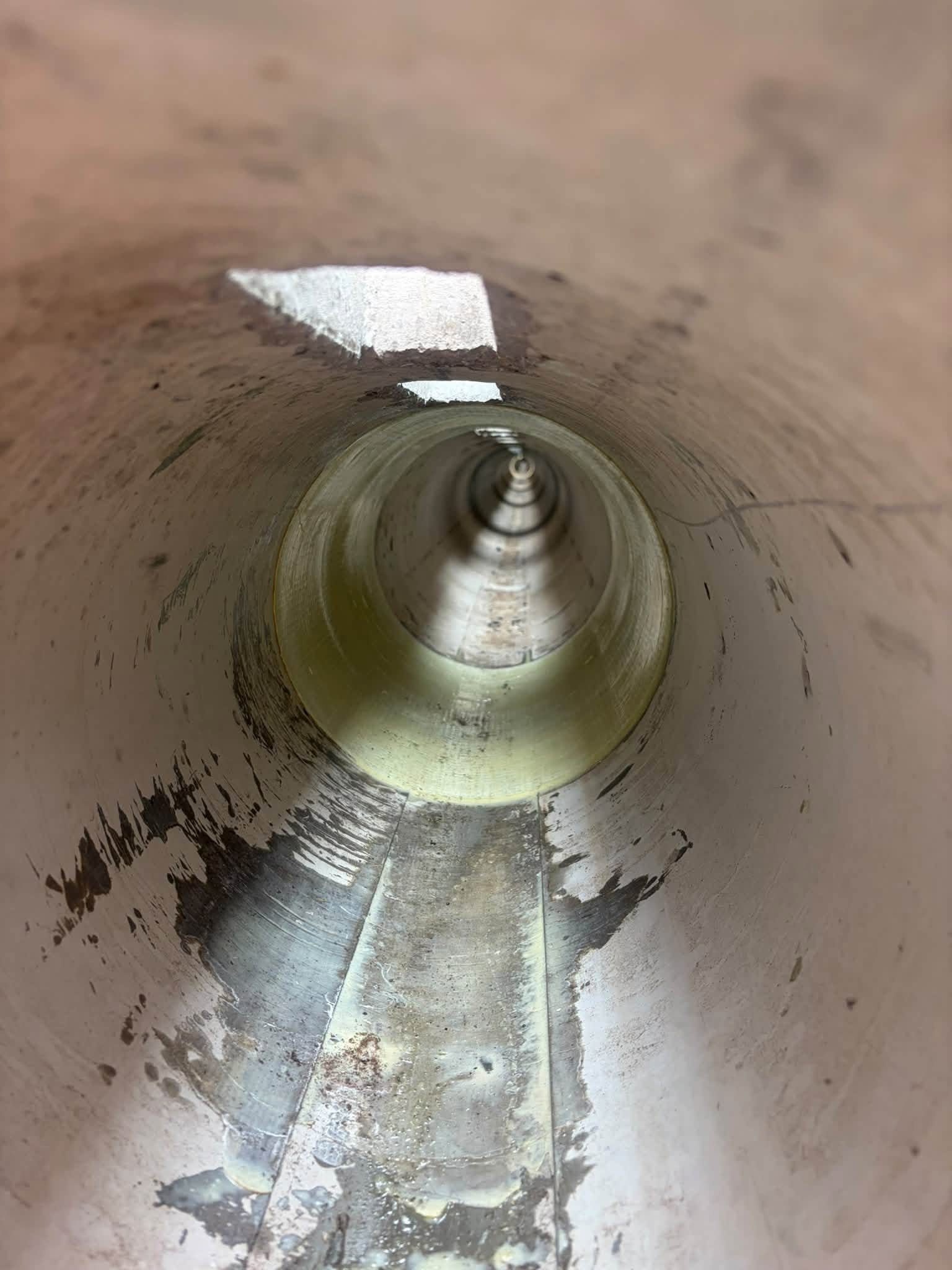 tunnel with light coming in from a gap at the top