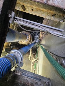 pipes and wires leading to a sewer