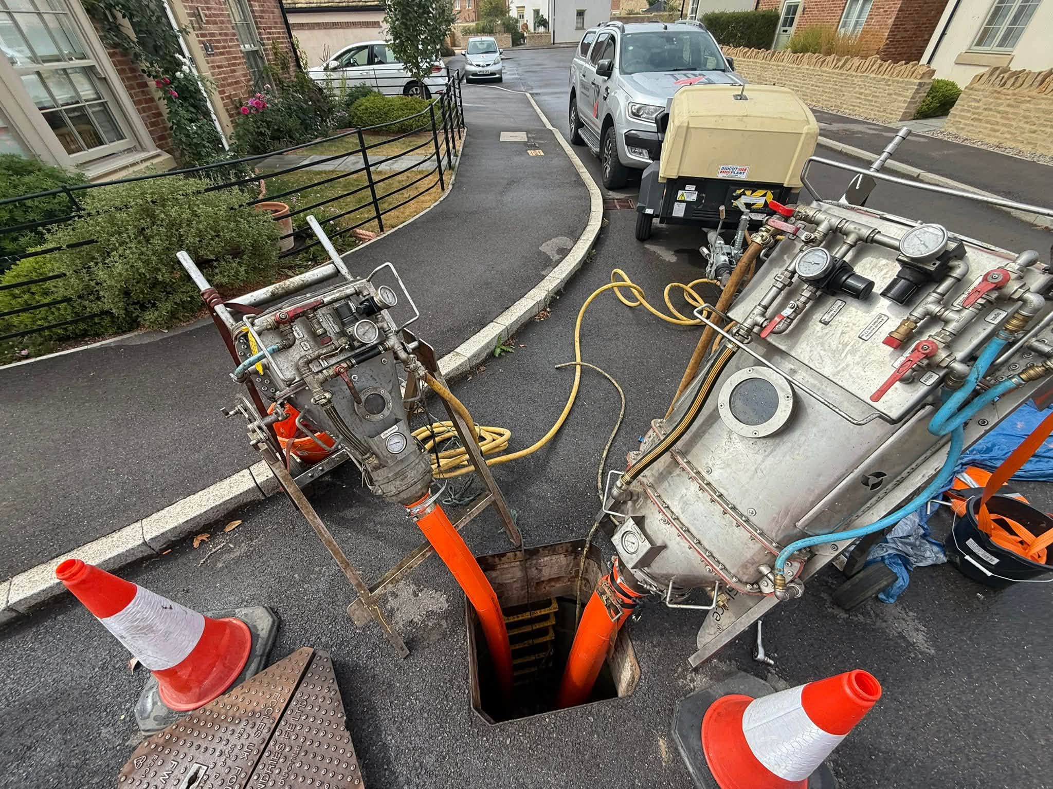pipe rehabilitation kit around a manhole in a residential area
