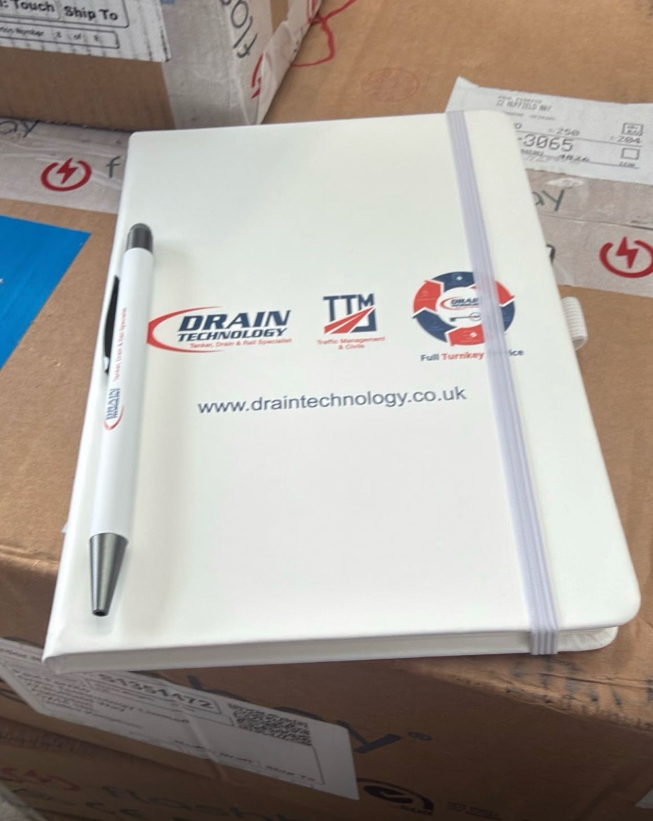 notepad with drain tech logo