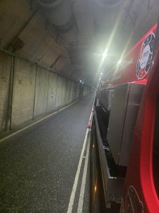 Red tanker in a dark tunnel