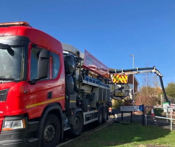 red tanker with pipes coming out the side